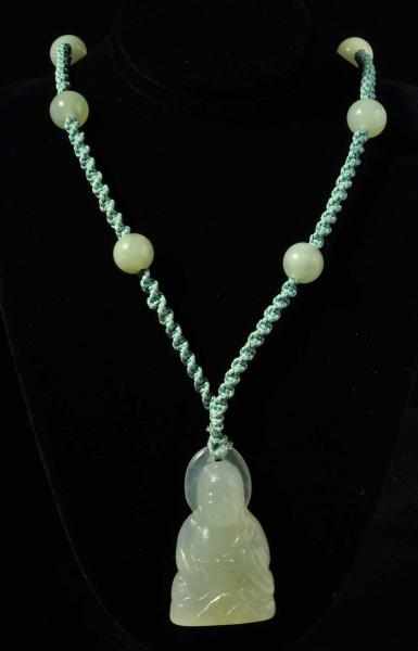 Appraisal: Lot of Jade Pieces Description Includes one Buddah pendant necklace