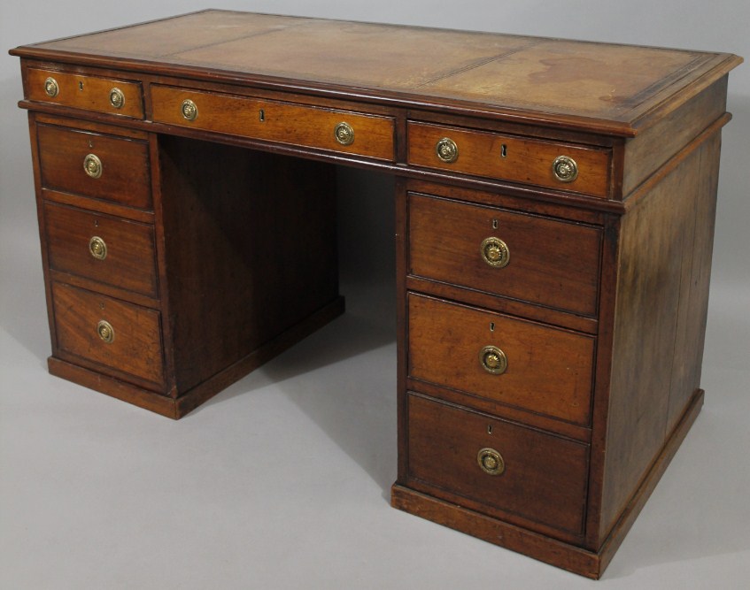 Appraisal: A late thC mahogany twin pedestal desk the overhanging top