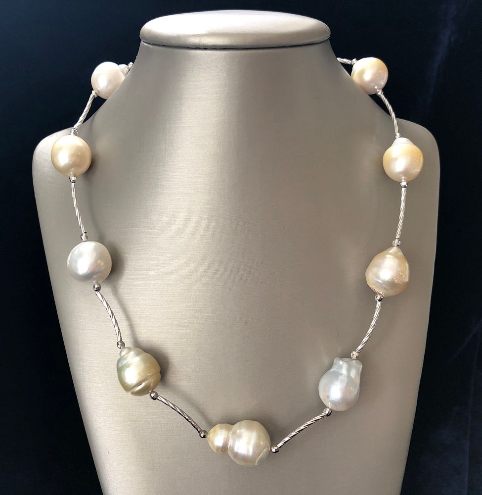 Appraisal: mm- mm White and Gold South Sea Baroque Pearl Tin