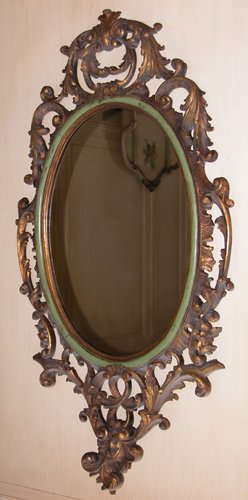 Appraisal: Title Carved and Polychromed Wall Mirror oval form Date late