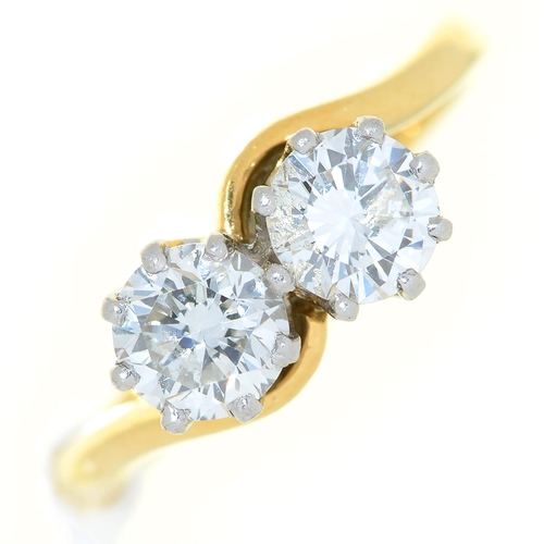 Appraisal: A diamond crossover ring with round brilliant cut diamonds each