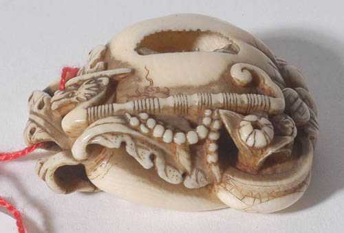 Appraisal: NETSUKE Japan th century L cm Ivory Auspicious objects such