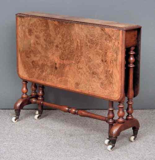 Appraisal: A Victorian figured walnut Sutherland table the crossbanded top with