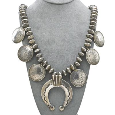 Appraisal: NAVAJO COIN SILVER SQUASH BLOSSOM NECKLACE Sixty handmade beads from