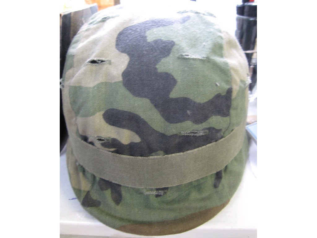 Appraisal: Military tin helmet and camouflage cover