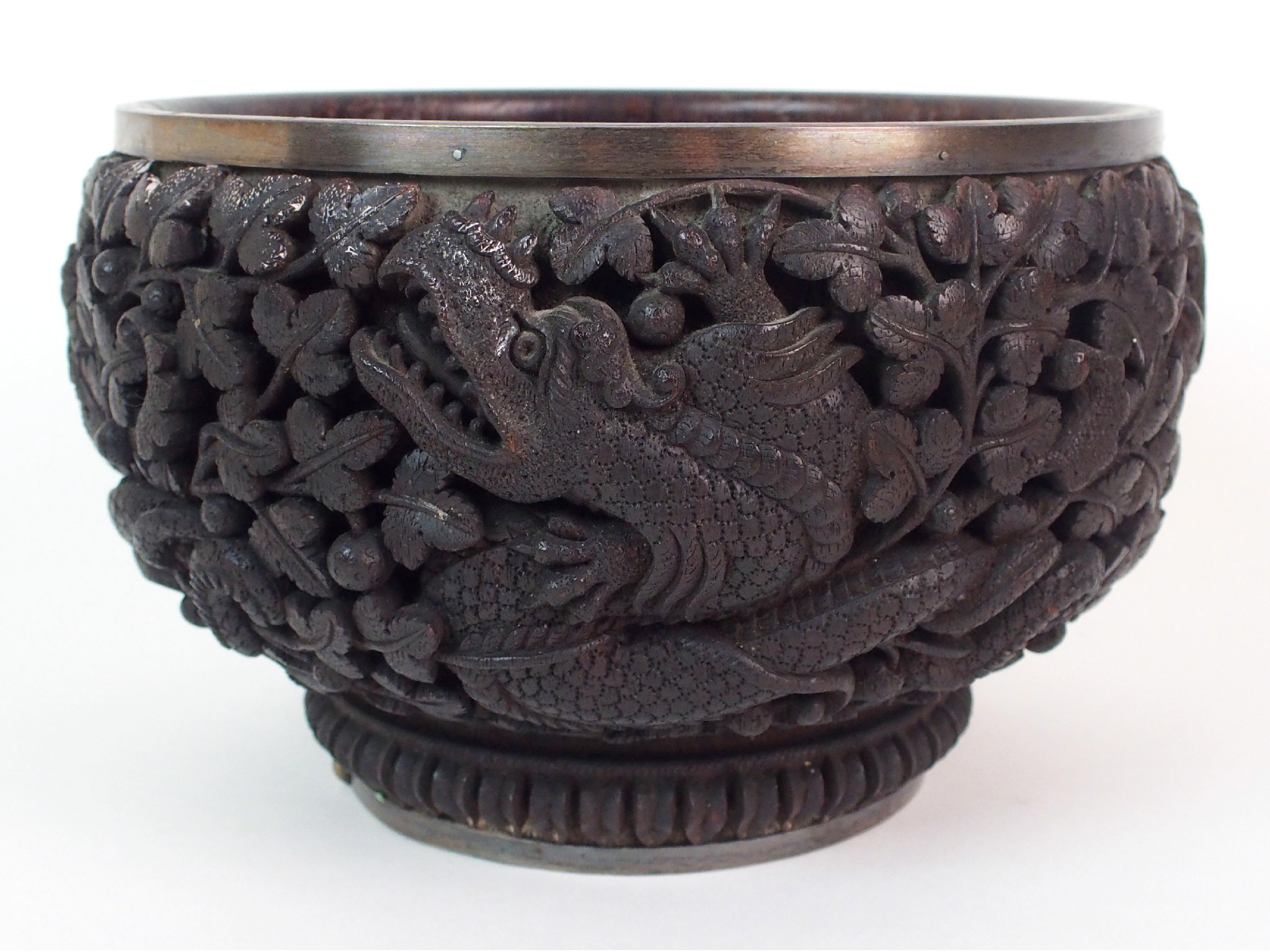 Appraisal: A Burmese carved hardwood bowldecorated in high relief with dragons