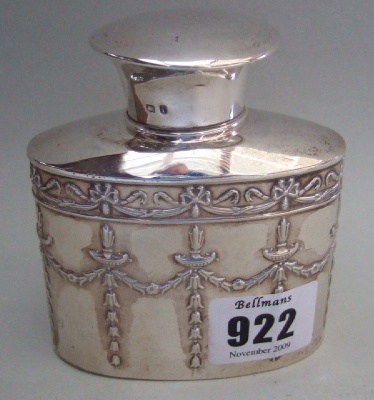 Appraisal: A silver oval tea caddy the body embossed with hairbell