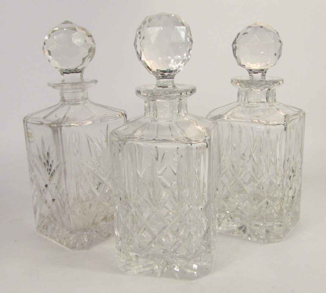 Appraisal: A pair of square cut glass whisky decanters and stoppers