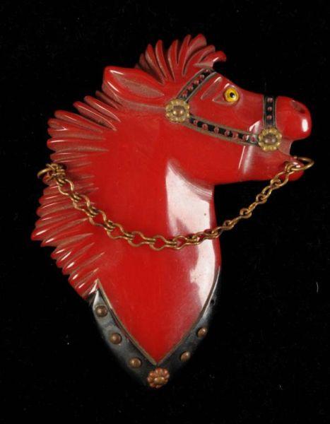 Appraisal: Bakelite Red Horse Pin with Metal Chain Condition Near Mint