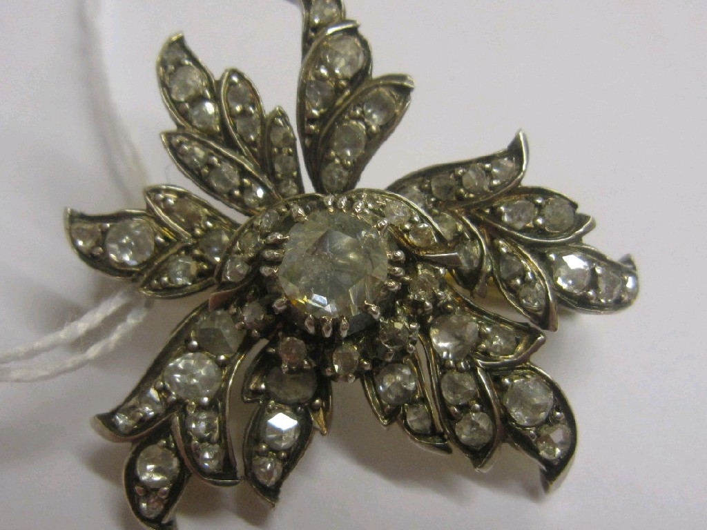 Appraisal: Victorian diamond flower brooch with central rough cut diamond measuring