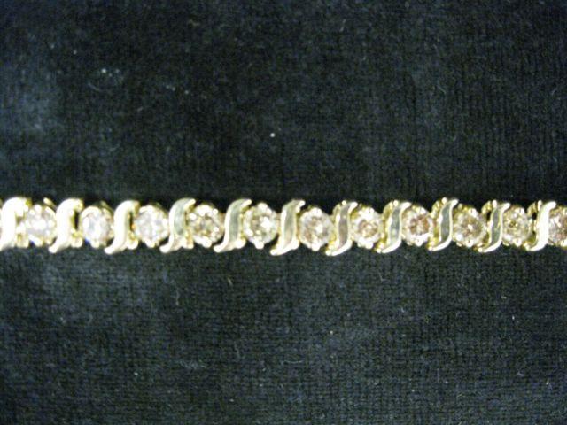 Appraisal: Diamond Tennis Bracelet carats of light champagne color round diamonds