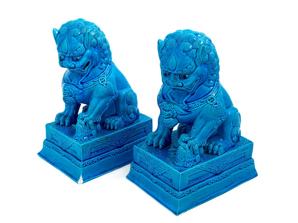 Appraisal: A Pair of Chinese Turquoise Glazed Porcelain Figures of Fu