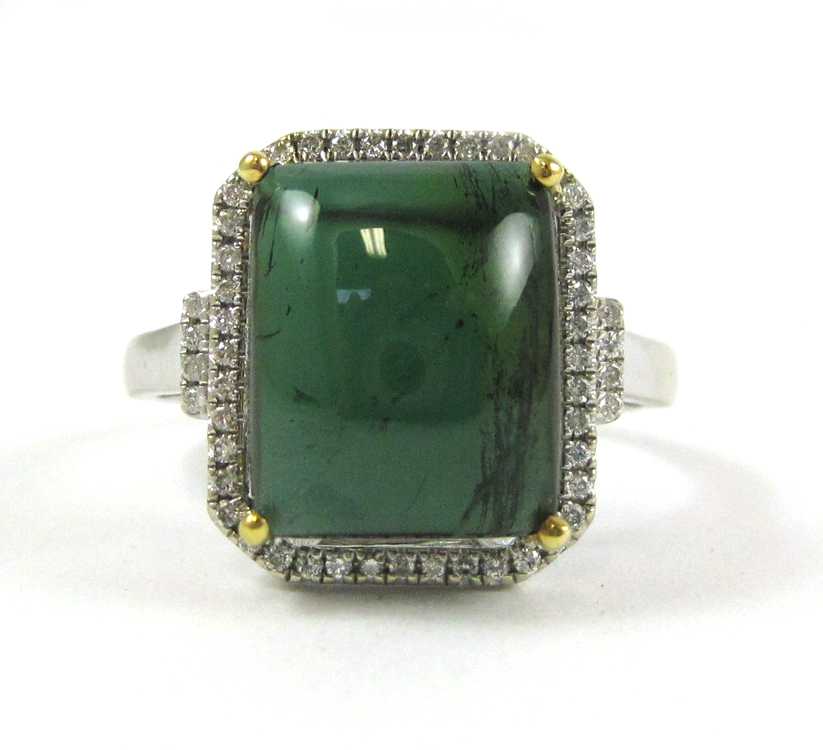 Appraisal: GREEN TOURMALINE AND FOURTEEN KARAT GOLD RING The white gold