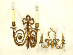 Appraisal: Four ormolu wall lights with twin foliate scroll branches and