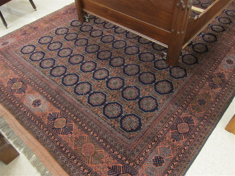 Appraisal: HAND KNOTTED ORIENTAL CARPET Afghan Belouch Turkoman design comprising repeating