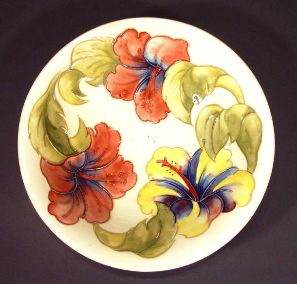 Appraisal: Moorcroft pottery shallow bowl hand painted and tubelined with hibiscus