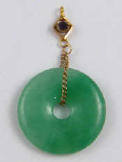 Appraisal: A jade disc pendant approx mm diameter