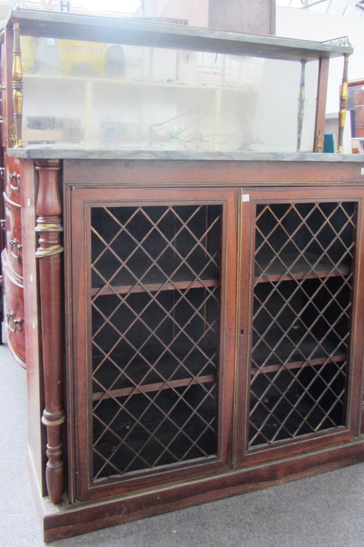 Appraisal: A Regency gilt metal mounted rosewood chiffonier with mirrored ledge