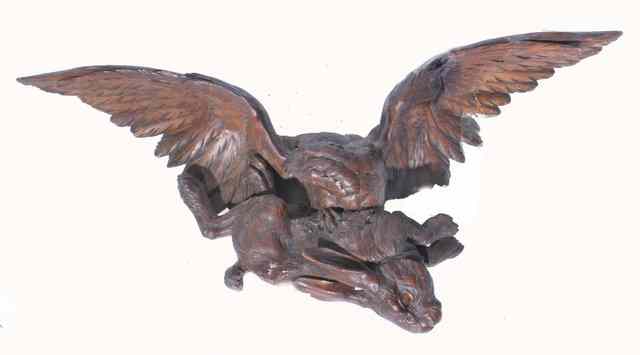 Appraisal: AN ANTIQUE BLACK FOREST CARVED PINE SCULPTURE OF A BIRD