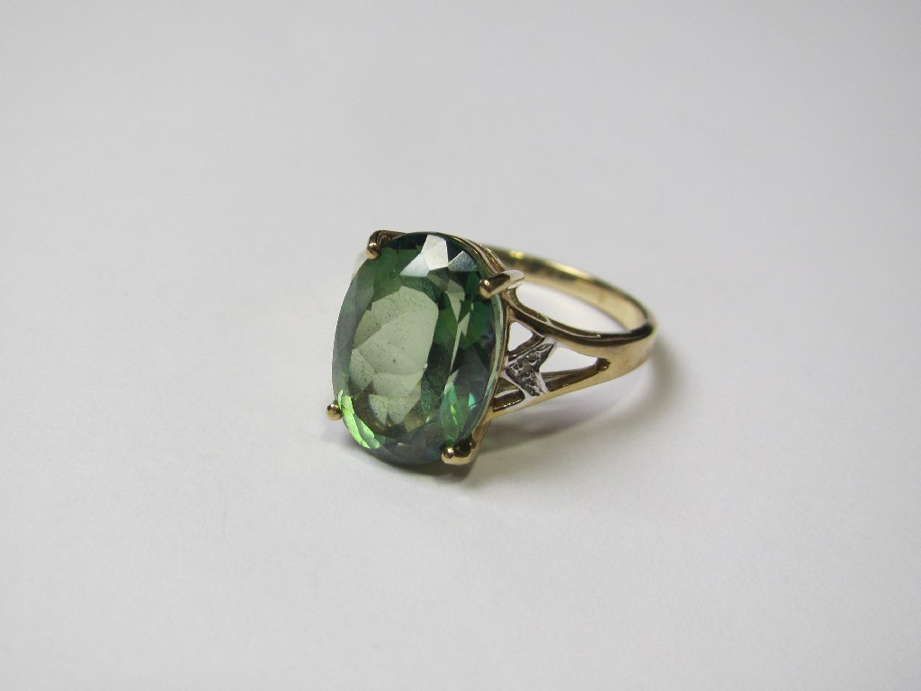 Appraisal: Nine carat gold green topaz and diamond set dress ring