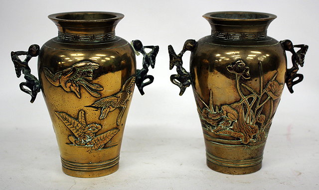 Appraisal: A PAIR OF JAPANESE BRONZE VASES of baluster form decorated