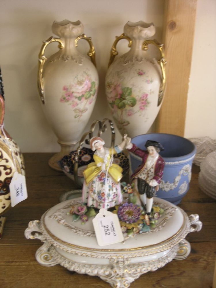 Appraisal: A pair of earthenware vases two-handled and printed with flowers