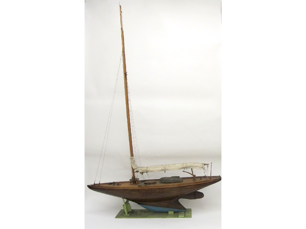 Appraisal: A pond yacht with single mast rolled canvas sail plank