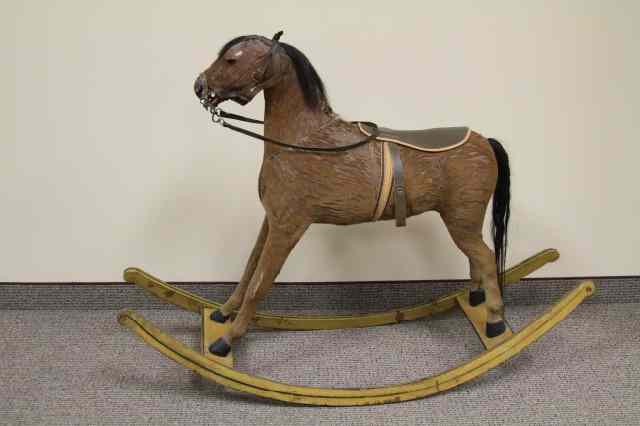 Appraisal: CHILD'S ROCKING HORSE Full figure with natural hide covering mounted