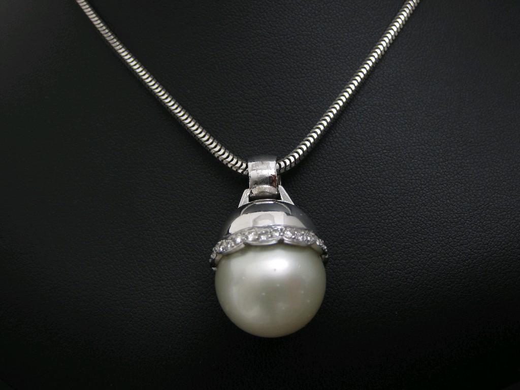 Appraisal: A South Sea Pearl and Diamond Pendant the single pearl