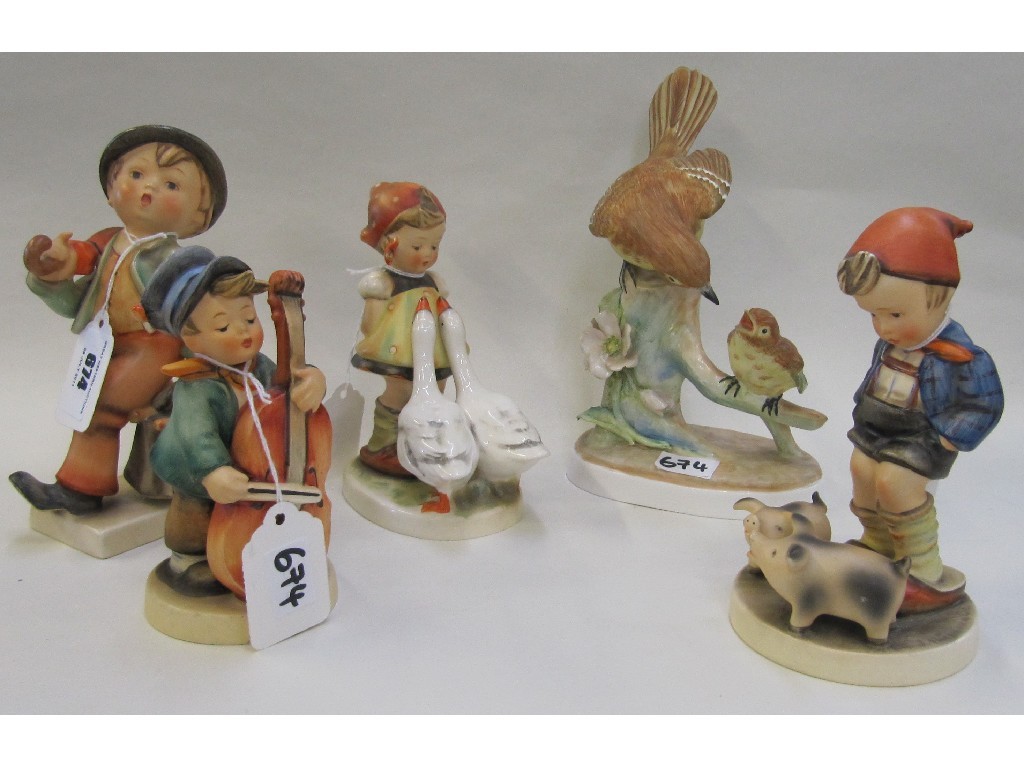 Appraisal: Four Hummel figures including Merry Wanderer slight chip to coat