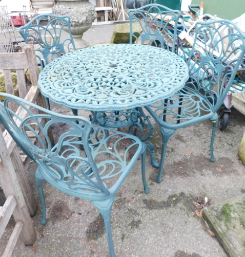 Appraisal: A green cast metal circular garden table and four chairs