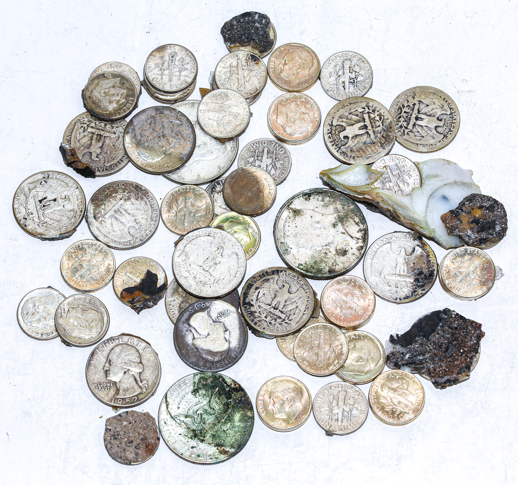 Appraisal: SILVER COINS WITH FOREIGN SUBSTANCE ON THEM Looks like some