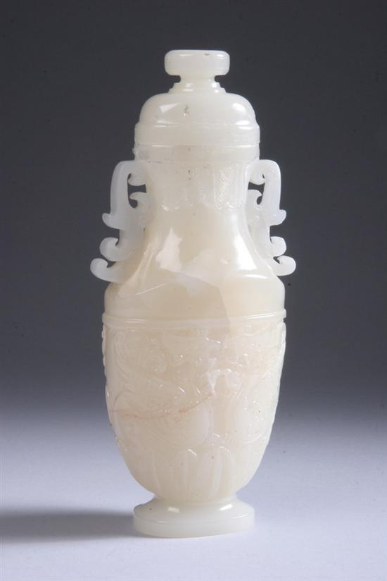 Appraisal: CHINESE WHITE JADE VASE AND COVER Flattened ovoid-form carved with