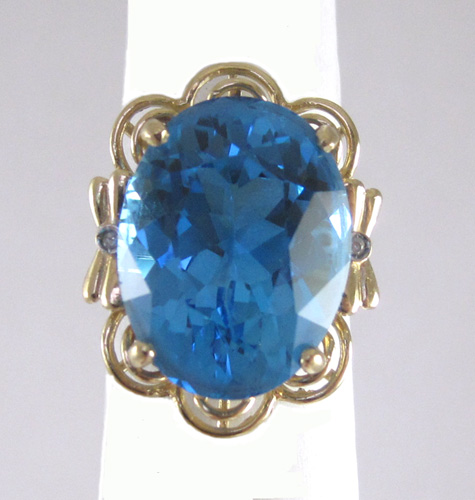 Appraisal: BLUE TOPAZ DIAMOND AND FOURTEEN KARAT GOLD RING set with