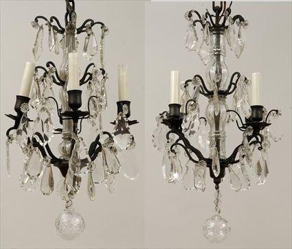 Appraisal: Pair of Louis XV-Style Wrought-Metal and Cut Glass Four-Light Chandeliers