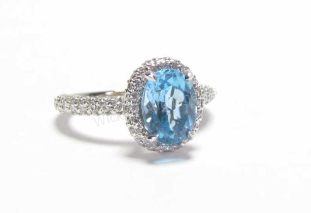 Appraisal: A lady's K white gold ring with oval shaped blue