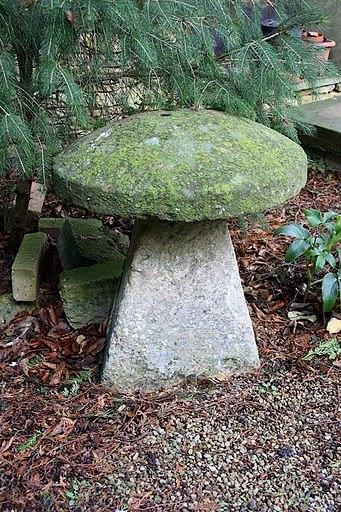 Appraisal: A staddle stone with circular top and a tapered base