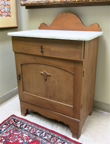 Appraisal: A VICTORIAN MARBLE-TOP PINE WASHSTAND Continental late th century having