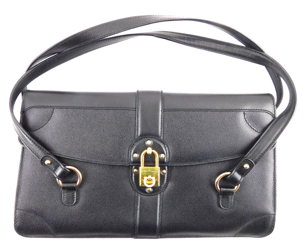 Appraisal: Salvatore Ferragamo purse black leather envelope shape with golden accents