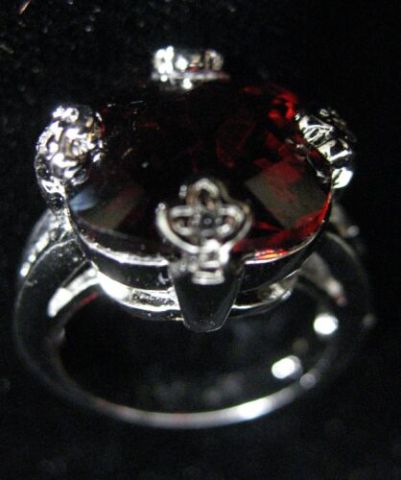 Appraisal: FANCY CUT GARNET CRYSTAL STERLING SILVR RING