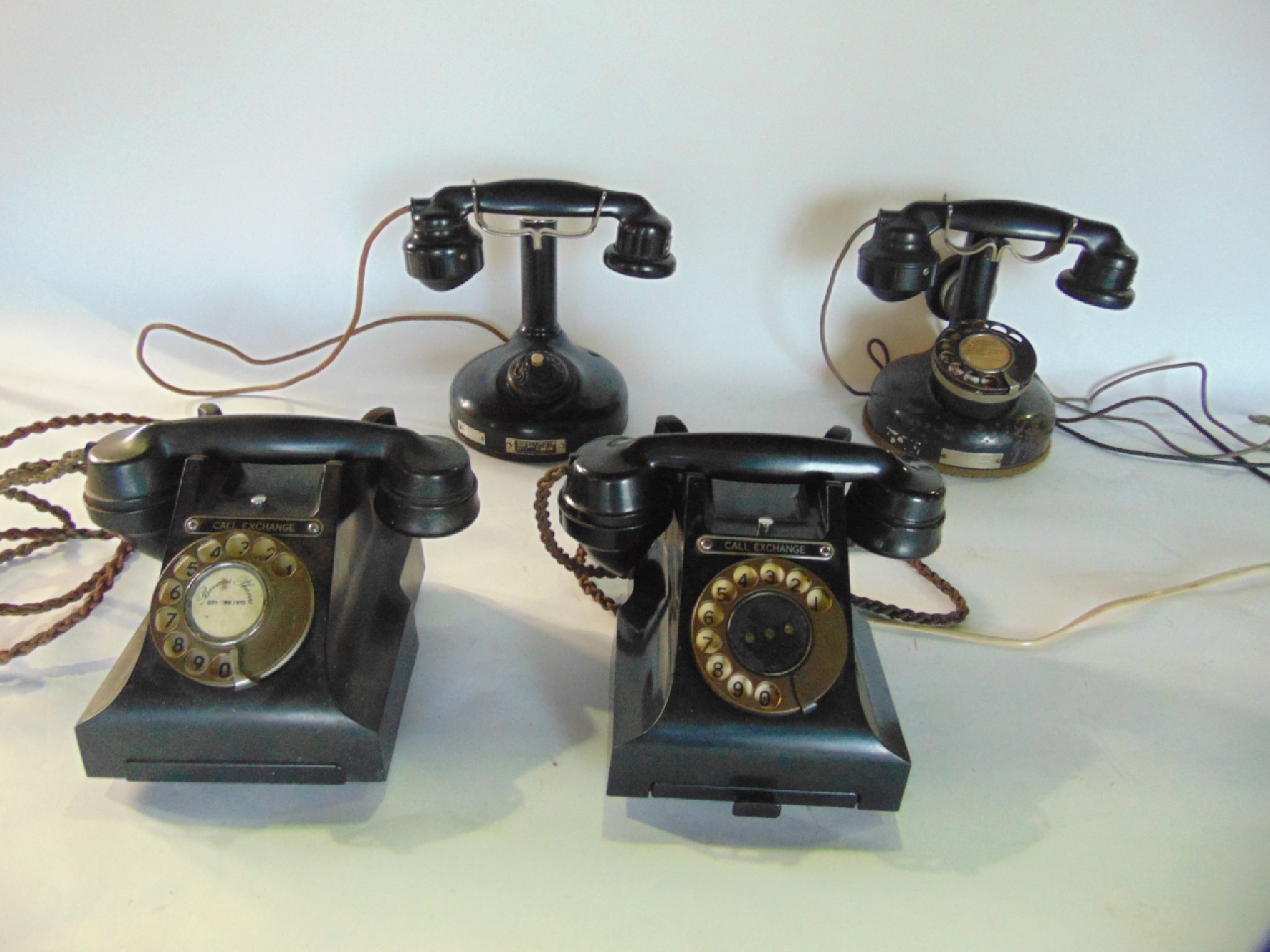 Appraisal: Antique telephones to include black Bakelite cased examples with circular