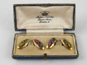 Appraisal: A pair of carat gold cufflinks with enamelled cars Chester