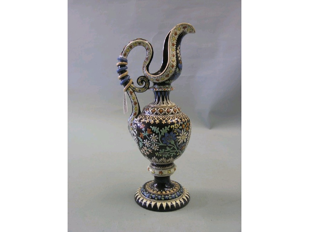 Appraisal: A late th century German enamelled terracotta ewer bulbous form