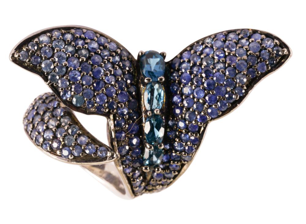 Appraisal: STERLING SILVER SAPPHIRE BLUE TOPAZ BUTTERFLY RINGcontaining four oval irradiated