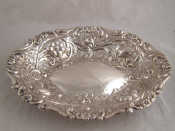 Appraisal: A Victorian silver shaped oval dish heavily embossed with scrolling