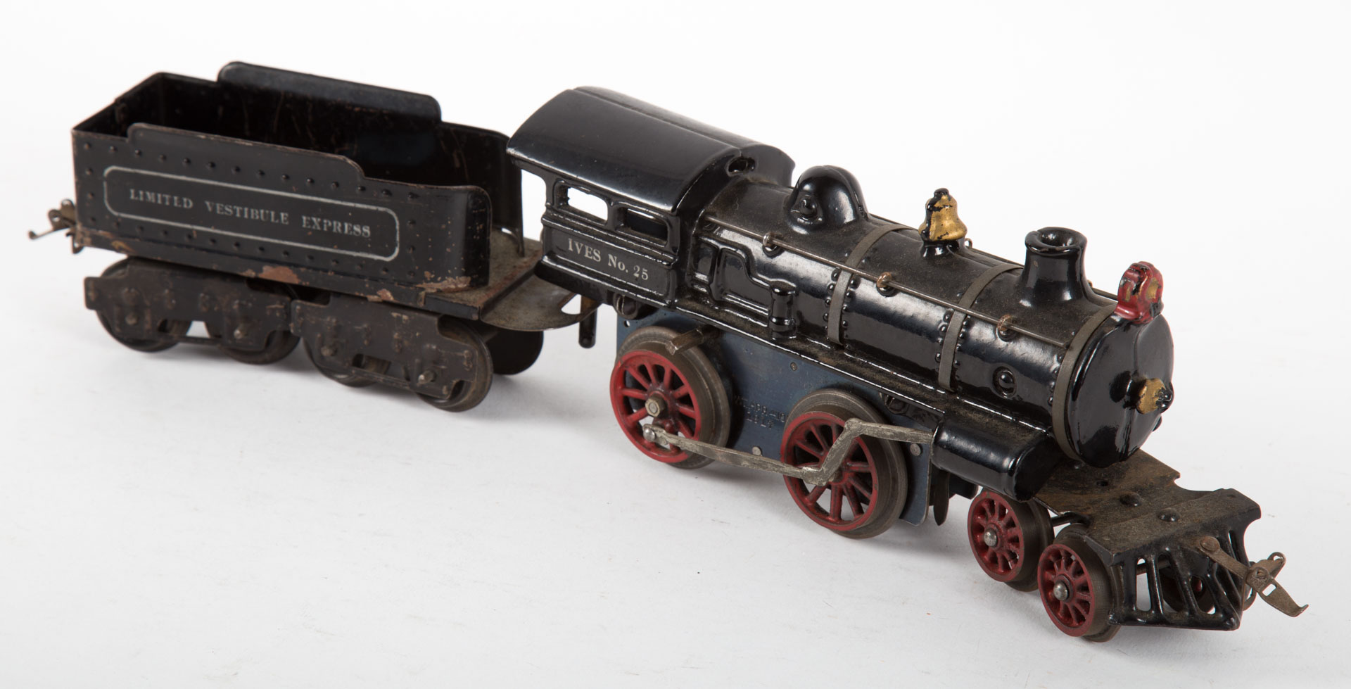 Appraisal: Ives engine and tender Ives with tin tender cast-iron car