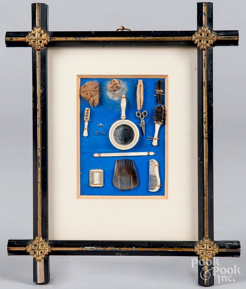 Appraisal: Framed miniature doll accessories Framed miniature doll accessories with a