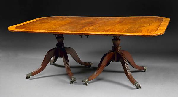 Appraisal: A Regency walnut crossbanded mahogany twin pedestal dining table first