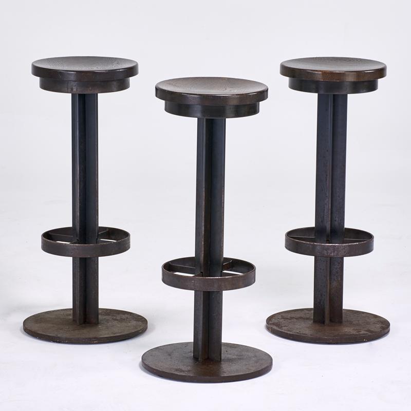 Appraisal: INDUSTRIAL Three bar stools USA s Patinated steel stained carved