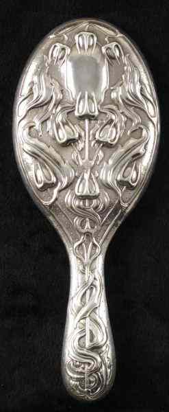 Appraisal: English Sterling Silver Hand Mirror Birmingham beautifully engraved with trident-shaped